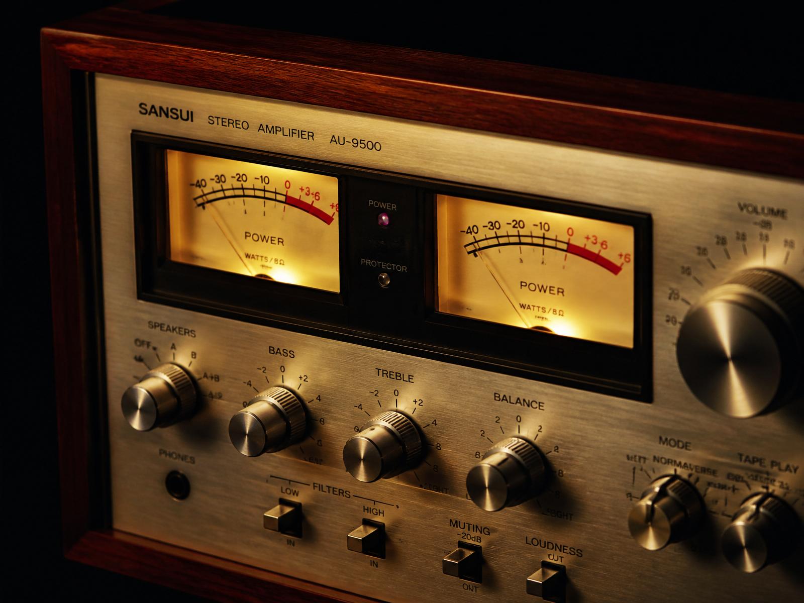 Vintage Sansui AU-9500 stereo amplifier with glowing VU meters